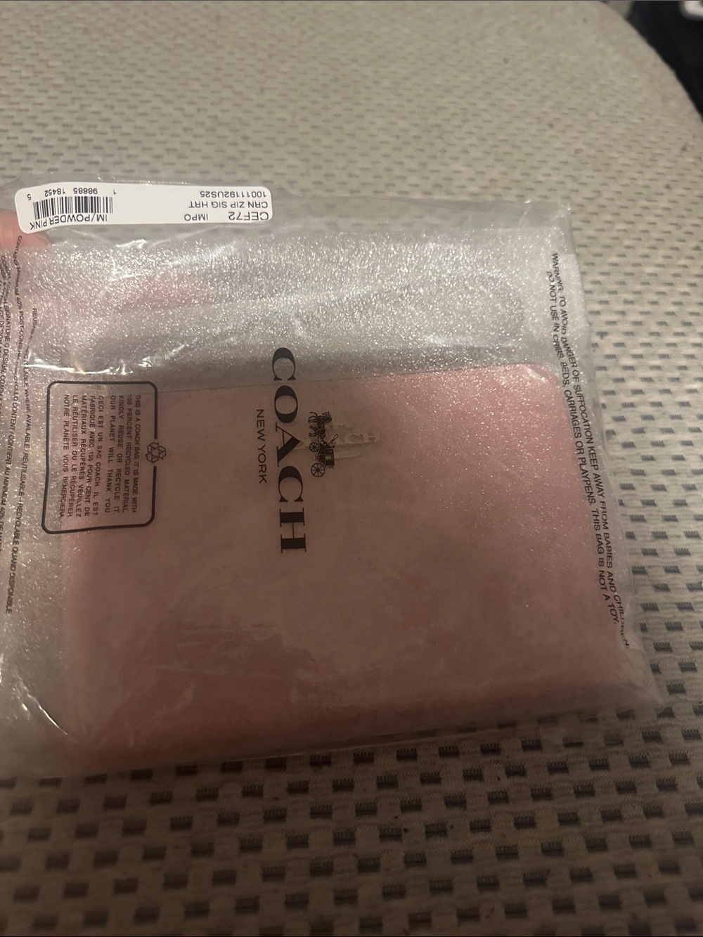 Coach Powder Pink wristlet  with Gold Logo